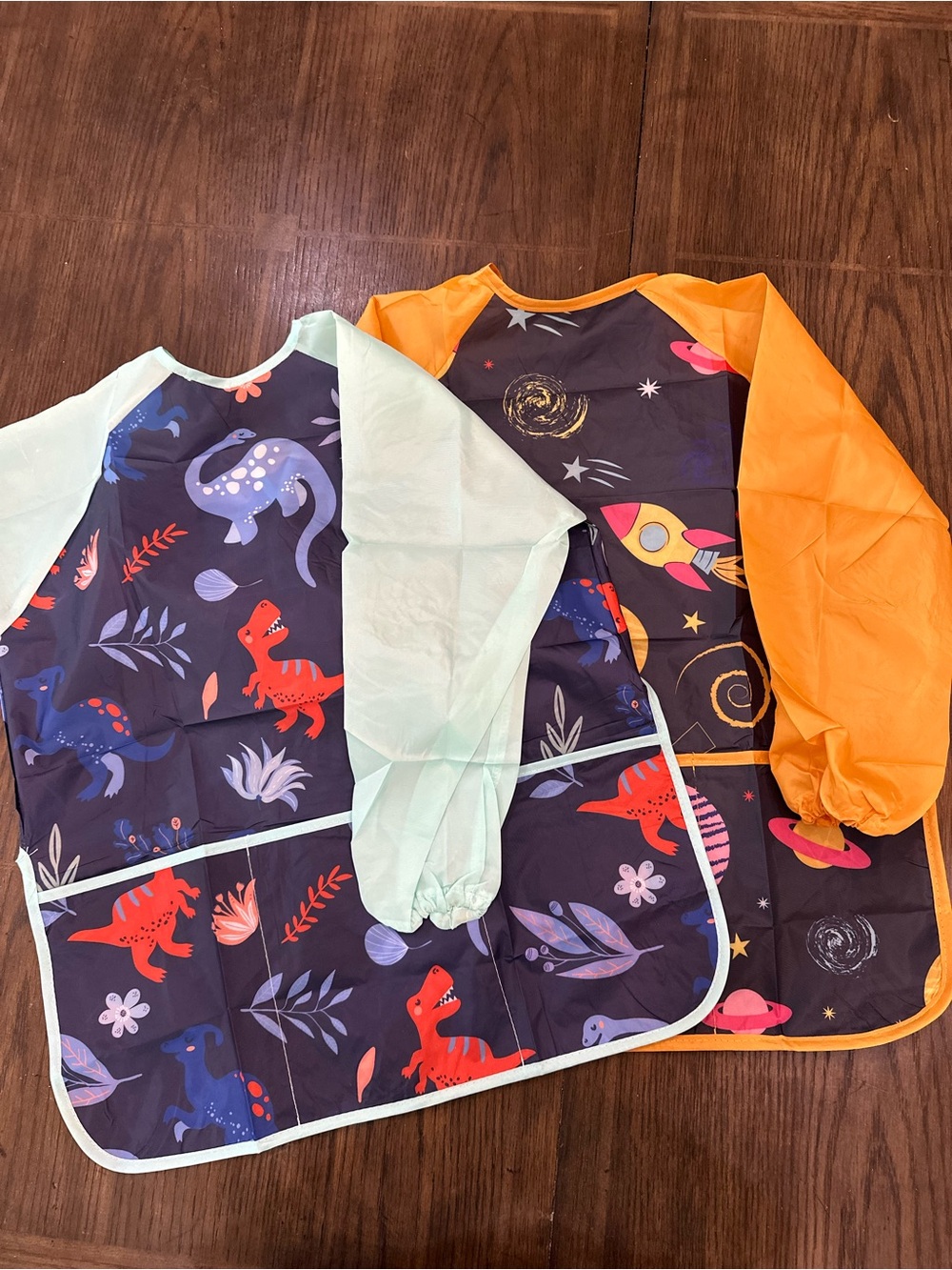 Lictin Craft Smock/ Painting Bibs for Kids 2 Pack spacecraft, and dinosaurs.